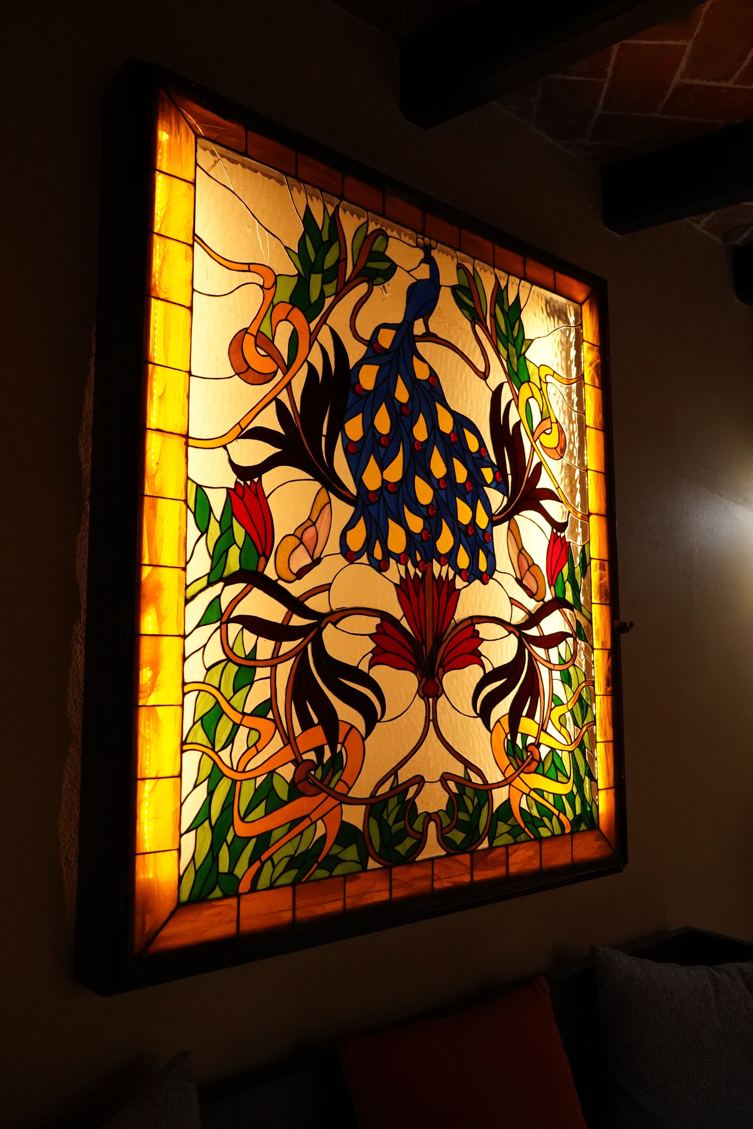 A stained glass window with a floral design.