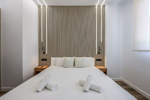 1 bedroom, desk, iron/ironing board, travel crib