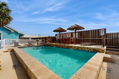 Coastal, dog-friendly townhouse with shared pool & large yard - steps to sand