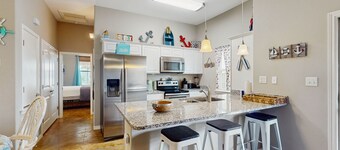 Coastal, dog-friendly townhouse with shared pool & large yard - steps to sand