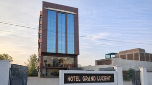 A modern hotel with a prominent sign reading "HOTEL GRAND LUCENT." - Hotel grand Lucent  (Mahaban)