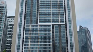A tall, modern building with the name "PLATINUM" prominently displayed at the top. - Platinum Suites Kuala Lumpur by Skyline (Kuala Lumpur)