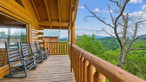 A wooden deck with benches overlooking a forested landscape. - Sky High Smoky Mountain Retreat w/ Views (Sevierville)