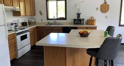 Charming 3-bedroom house in enchanting Seeley Lake with WiFi in 6 acres .