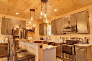 Fridge, microwave, oven, stovetop - Stylish 3‑Bedroom Cabin with Arcade & Mountain Views (Gatlinburg)