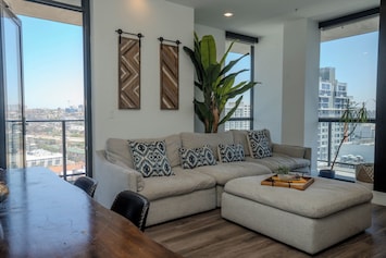 Open-concept living room with plush seating