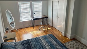 A bedroom with a desk, chair, wardrobe, and a large rug. - Swampscott! Walk Dtwn and beach (Swampscott)