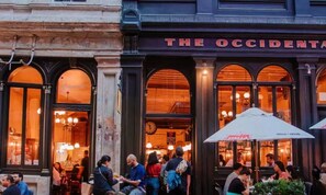 A building with a sign reading "THE OCCIDENTAL". - Boutique Apt in the Heart of Auckland Zodiak Stays (Auckland)