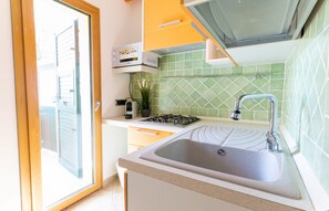 Apartamento luxo, cozinha americana | Cozinha privada | Geladeira grande, micro-ondas, cooktop, máquina de café expresso