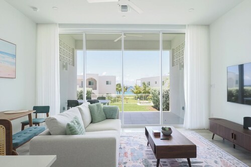 Bright and Chic Coastal Retreat with Ocean Views in Charming West Bay