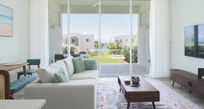 Bright and Chic Coastal Retreat with Ocean Views in Charming West Bay