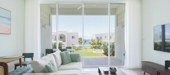 Bright and Chic Coastal Retreat with Ocean Views in Charming West Bay