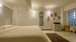 A bedroom with a large bed, a dresser, a mirror, and a window with blinds. - M4 Istiklal Spacious and Central 1+1 Apartment (Istanbul)