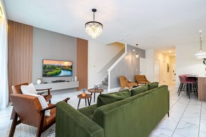 Comfort Townhome | Living area | 1-inch Smart TV with cable channels, Netflix, Hulu - Vibrant 5Br W/ Pool & Waterpark @Storey Lake 4811M (Kissimmee)