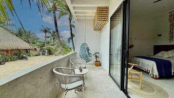 Habitación doble Confort, vista parcial al océano | Terraza o patio