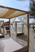 On the beach, sun loungers, beach umbrellas, beach towels