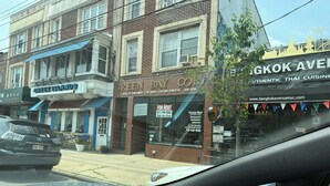 A street view with a building labeled 'Green Bay Container Services' and 'Greek Islands'. - Chic apartment in cool Huntington with AC, fitness room. Private bathroom. (Huntington)