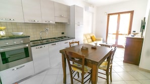 Standard Apartment, 1 Bedroom, Terrace | Private kitchen | Highchair