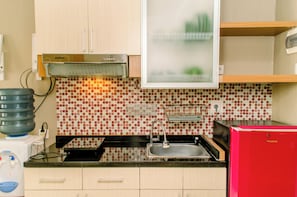 Standard Studio | Private kitchen - Comfy And Warm Studio At Taman Melati Margonda Apartment (Depok)