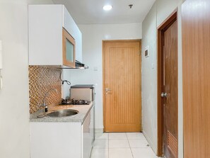Private kitchen - Serene And Nice Studio At Cinere Bellevue Suites Apartment (Depok)