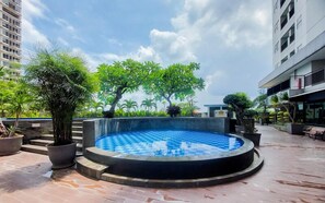 Pool - Comfortable And Homey Studio Room Parkland Avenue Apartment (South Tangerang)