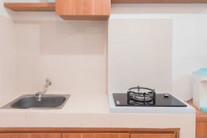 Standard Studio | Private kitchen - Good And Homey Studio Apartment Urban Heights Residences (South Tangerang)