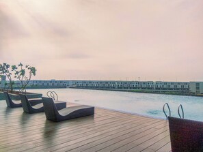 Outdoor pool - Well Furnished Studio Apartment At Vasanta Innopark (Cikarang)