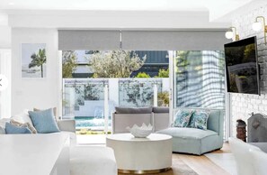 TV, fireplace, books, offices