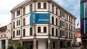 A corner building with a sign for "ASPHODEL inn". - Asphodel Inn - Newly Renovated (Singapore)