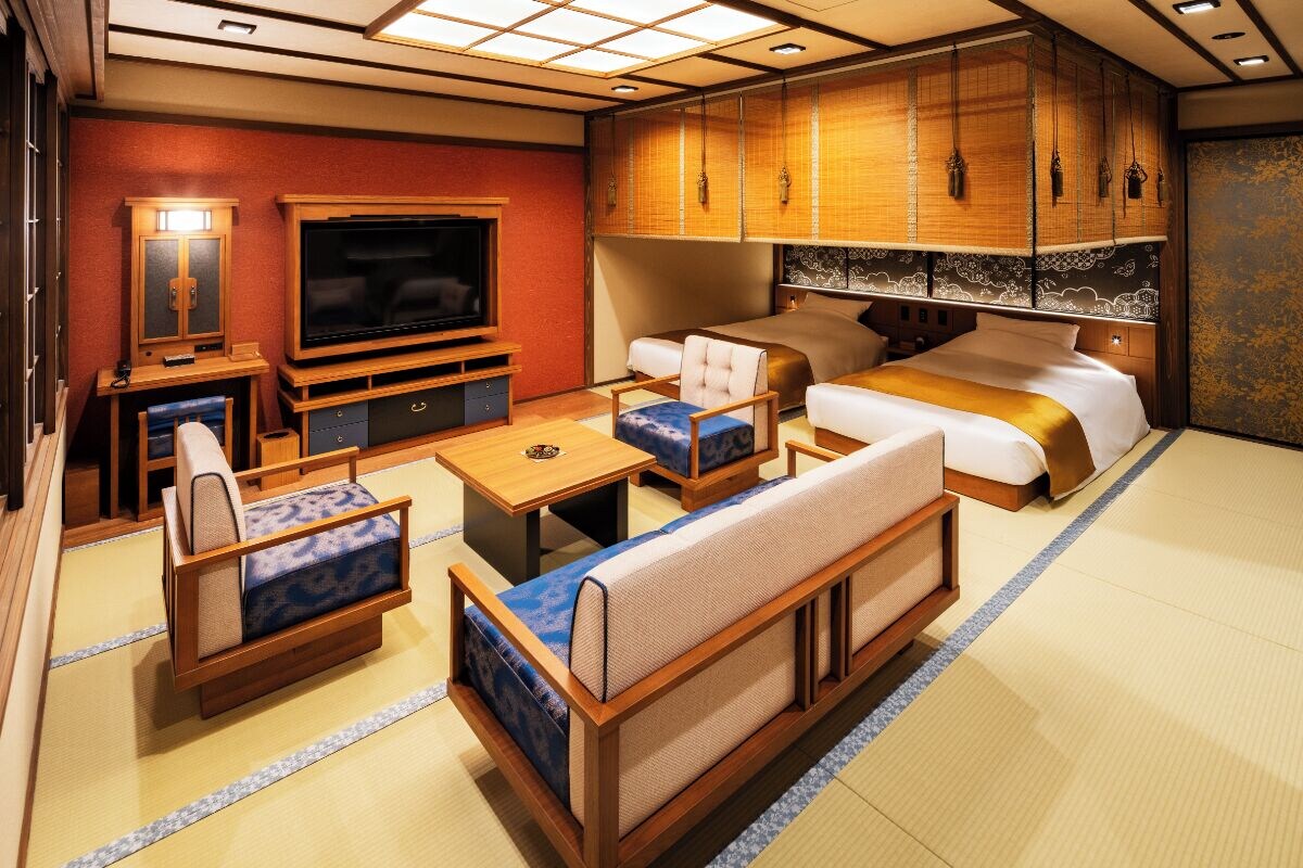 A traditional Japanese-style room with tatami flooring, a television, a sofa, a bed, and wooden cabinets.
