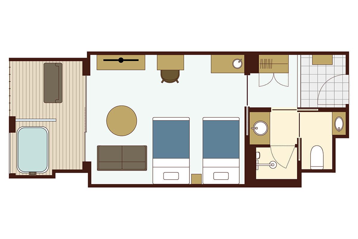 A hotel room layout with a bed, a desk, a chair, a small table, a sofa, a wardrobe, a bathroom with a toilet, sink, and shower.