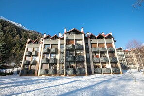 A multi-story hotel with balconies and a snow-covered landscape. - Grand Roc B221 260m from Slopes, View, Parking & WiFi, Argentière (Chamonix), France (Argentière (Chamonix))