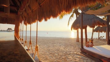 On the beach, sun loungers, beach towels