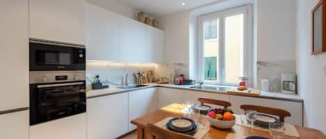 Family Apartment, 2 Bedrooms, 2 Bathrooms (Castelletto House Genova City Center) | Private kitchen | Fridge, microwave, oven, stovetop