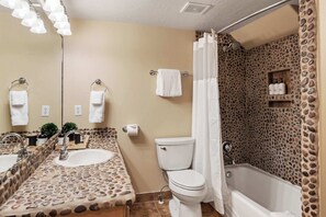 Shower, hair dryer, towels, shampoo