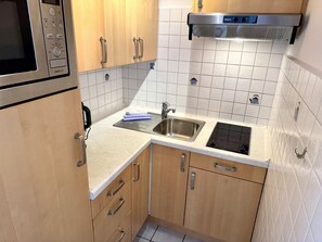 Fridge, microwave, stovetop, coffee/tea maker