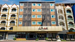 A hotel with a modern facade, multiple balconies, and a prominent sign for J.A. SIA. - Ultimate Twin Stay | Cozy, Smart Comfort (Pattaya)