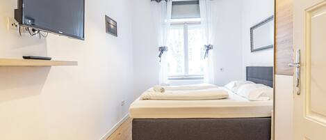 Casa conforto, 2 quartos, sacada, vista para a cidade | Roupas de cama antialérgicas, Wi-Fi de cortesia, roupa de cama