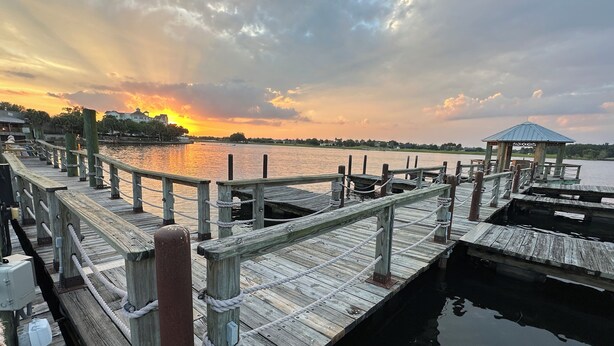 A wooden pier extending into calm water with a gazebo at the end. - Sunscape Palms - 3/2 with Golf Cart & Grill in The Village of St. James (St. James, The Villages)