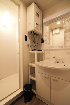 Shower, free toiletries, hair dryer, slippers