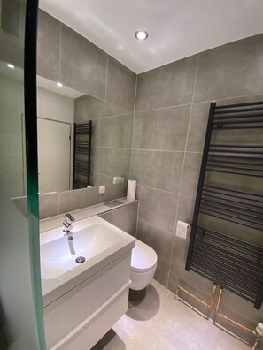 Shower, hair dryer, towels, soap