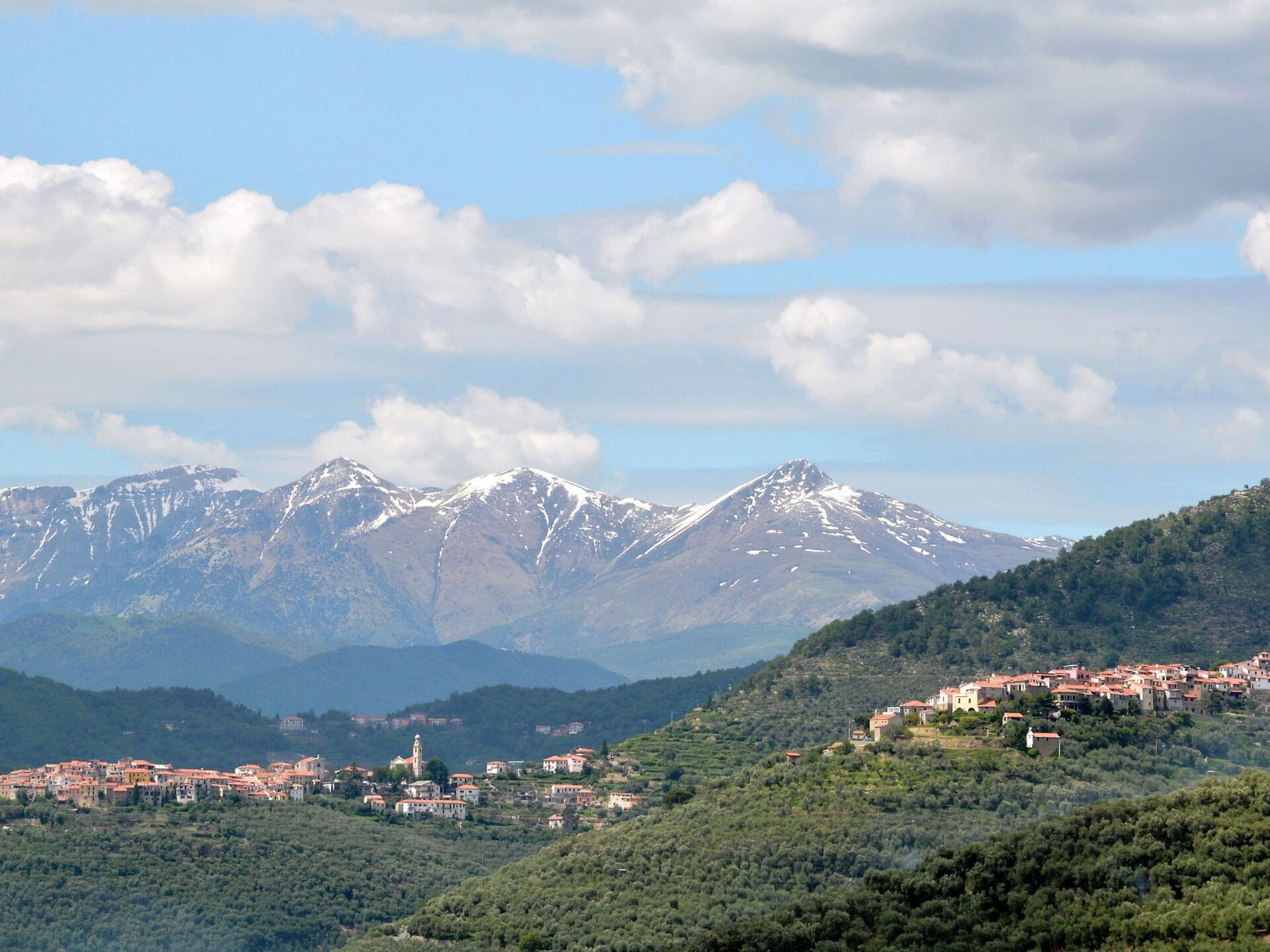 A mountainous landscape with a town nestled in the valley.