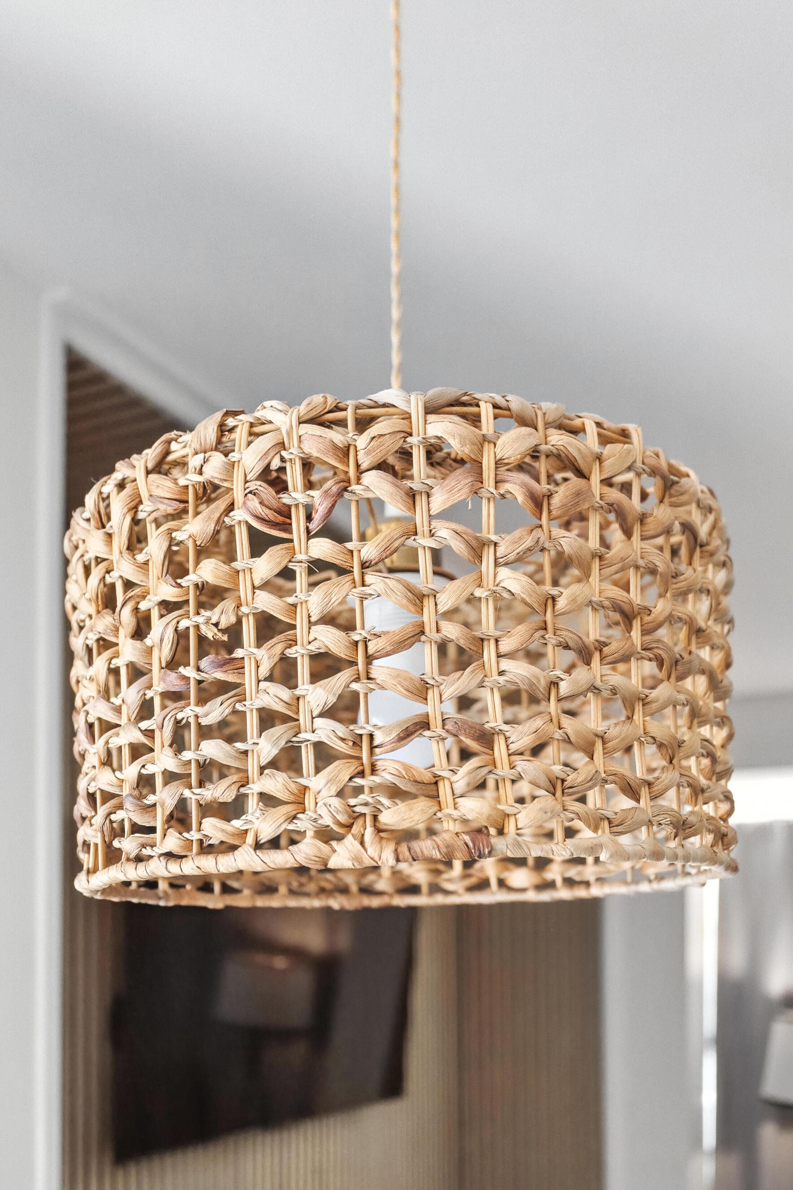 A woven rattan pendant light fixture.