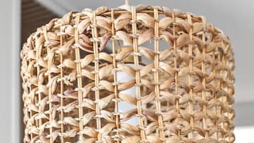 A woven rattan pendant light fixture.