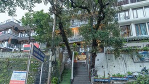 A staircase leading to a hotel named 'Excel Hotels & Resort Nainital'. - Excel Hotels & Resorts Mall Road Nainital (Nainital)