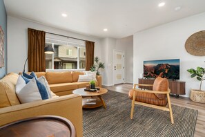 Townhome, Multiple Beds, Patio (2938 Barnstormer St Unit #1) | Living area | 55-inch flat-screen TV with digital channels - Mosaic Modern - Dog Friendly, Pool + King Suite (Fort Collins)