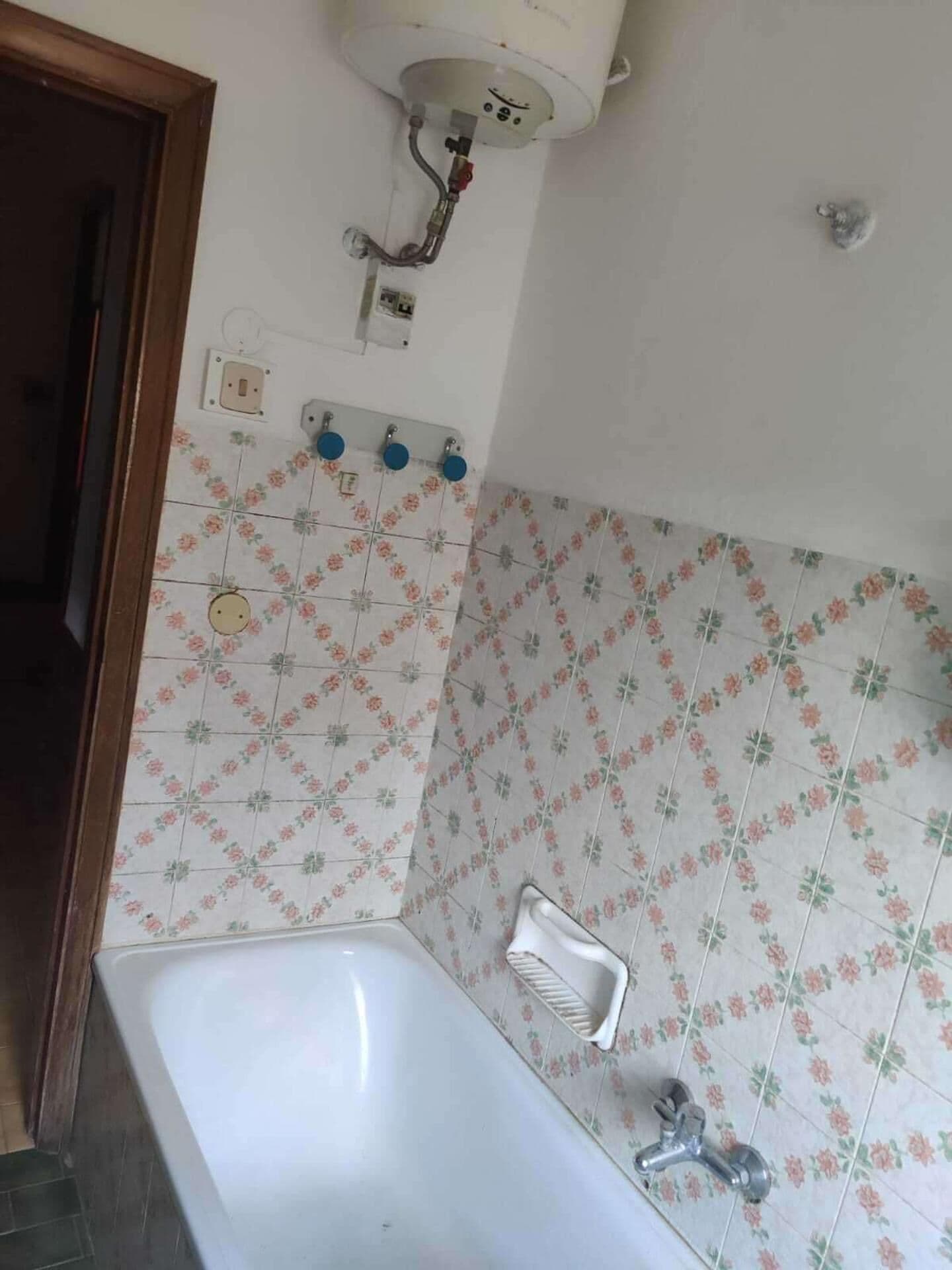 A bathroom with a bathtub, a shower, and a toilet.