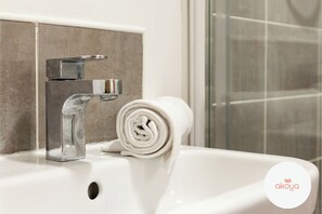 Hair dryer, towels, soap, toilet paper