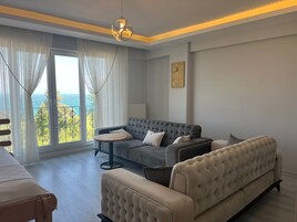 Suite estudio Deluxe, vistas al mar | Zona de estar