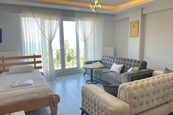 Deluxe studio suite, uitzicht op zee | Woonruimte